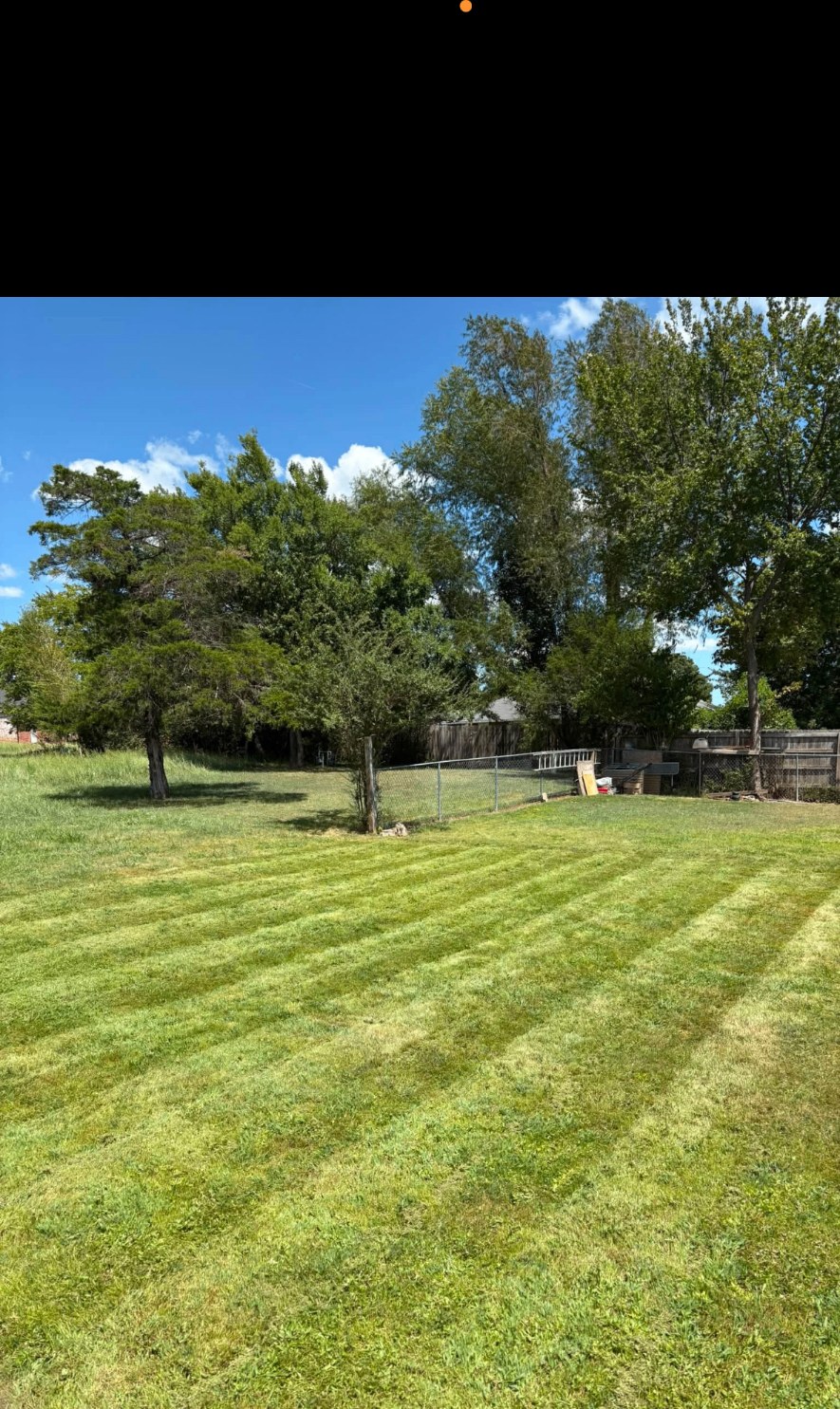 Finished lawn care & striping by APEX Construction & Landscaping